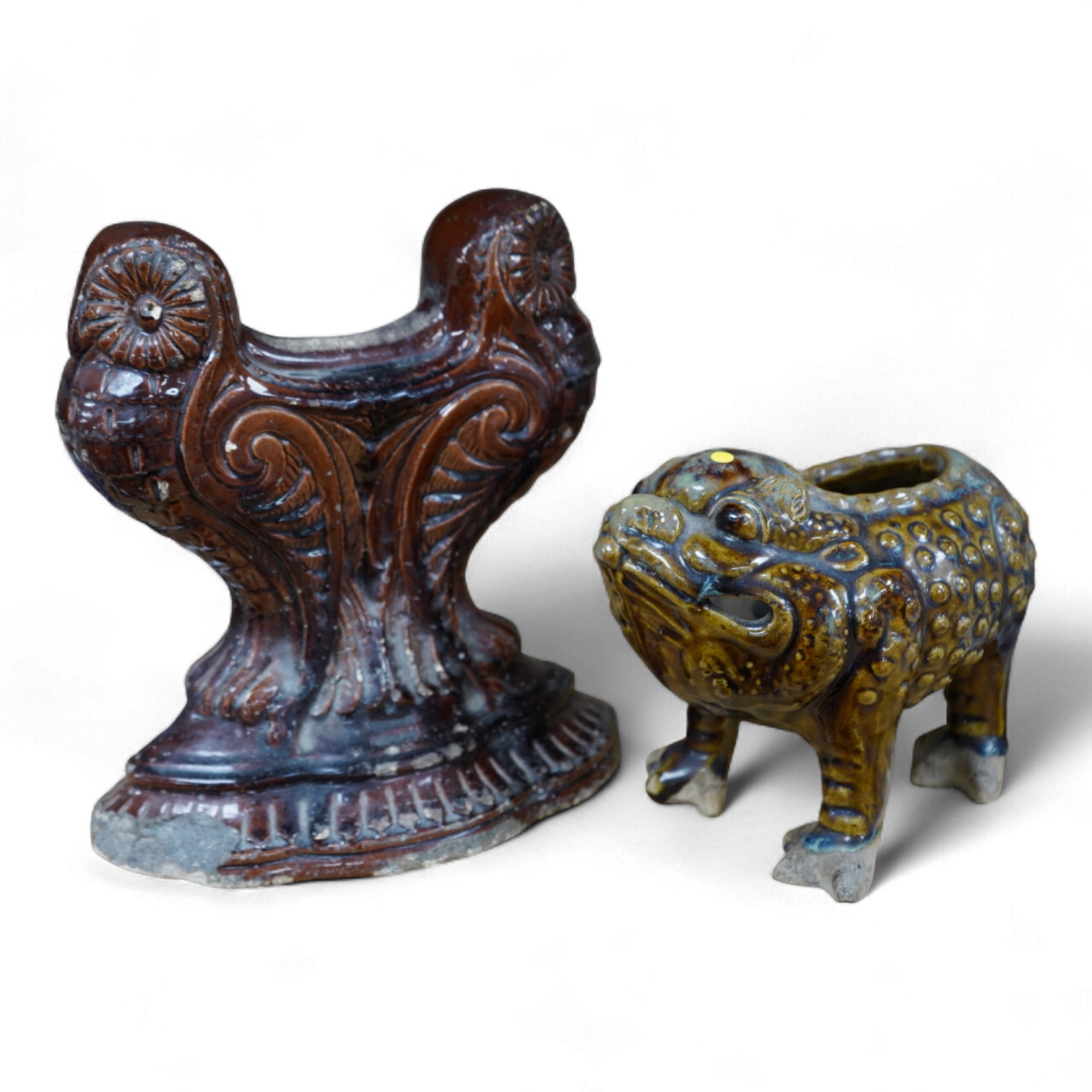 A late 19th century glazed pottery grotesque three legged toad spoon warmer in the manner of Dunmore or Burmantofts, and a Doulton owl andiron, largest 24cm high